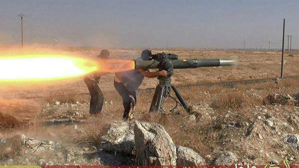 In this picture released on June 26, 2015, by a website of Islamic State militants, Islamic State militants fire an anti-tank missile in Hassakeh, northeast Syria In this picture released on June 26, 2015, by a website of Islamic State militants, Islamic State militants fire an anti-tank missile in Hassakeh, northeast Syria - Sputnik International