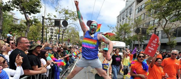 Benj Curtis jumps for joy during the annual Gay Pride Parade in San Francisco, California on June 28, 2015, two days after the US Supreme Court's landmark ruling legalizing same-sex marriage nationwide Benj Curtis jumps for joy during the annual Gay Pride Parade in San Francisco, California on June 28, 2015, two days after the US Supreme Court's landmark ruling legalizing same-sex marriage nationwide - Sputnik International