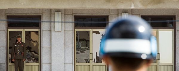 A South Korean JSA guard (front R) and North Korean guard (L) stand guard opposite each other at the border of the truce village of Panmunjom in the Demilitarized zone (DMZ) dividing the two Koreas. File photo. A South Korean JSA guard (front R) and North Korean guard (L) stand guard opposite each other at the border of the truce village of Panmunjom in the Demilitarized zone (DMZ) dividing the two Koreas. File photo. - Sputnik International