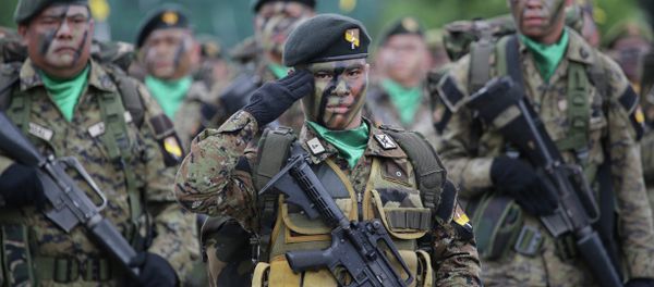 Philippine troopers participate in ceremonies on the 79th anniversary of the Armed Forces of the Philippines (AFP) at Camp Aguinaldo military headquarters in suburban Quezon city, north of Manila, Philippines on Thursday, Dec. 18, 2014 - Sputnik International