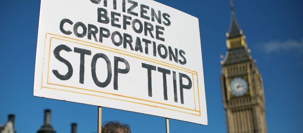 A woman demonstrates in central London on October 11, 2014, against the proposed Transatlantic Trade and Investment Partnership (TTIP). - Sputnik International