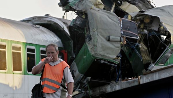 A rescue worker leaves the scene of the accident of a long-distance, international passenger train. A rescue worker leaves the scene of the accident of a long-distance, international passenger train. - Sputnik International