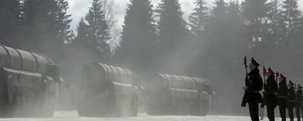 Russian soldiers stand near Topol-M ICBMs while participating in a rehersal for the nation's Victory Day parade outside Moscow in Alabino on April 22, 2008 - Sputnik International
