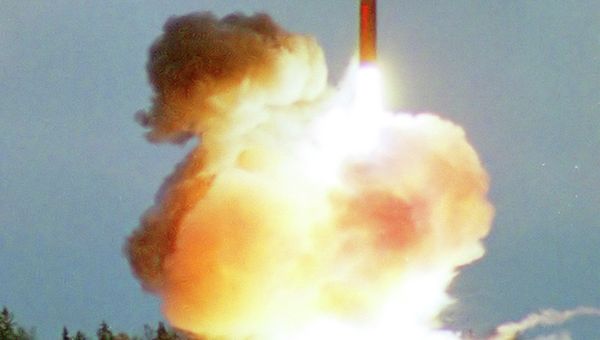 In this 2001 file photo an intercontinental ballistic Topol-M missile blasts off from an undisclosed location in Russia - Sputnik International