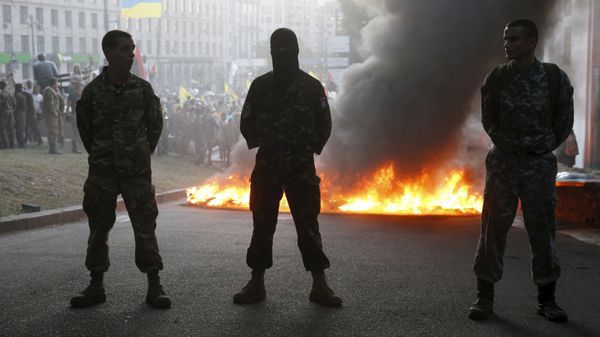 Tyres are set on fire during a rally held by members of the far-right radical group Right Sector, representatives of the Ukrainian volunteer corps and their supporters in central Kiev, Ukraine Tyres are set on fire during a rally held by members of the far-right radical group Right Sector, representatives of the Ukrainian volunteer corps and their supporters in central Kiev, Ukraine - Sputnik International