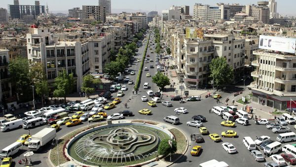 A general view shot taken on June 30, 2015, shows traffic on a roundabout in the Syrian capital Damascus A general view shot taken on June 30, 2015, shows traffic on a roundabout in the Syrian capital Damascus - Sputnik International