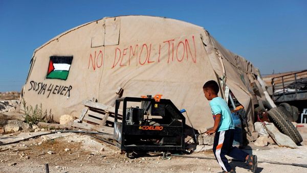 A Palestinian boy runs outside his family tent in the village of Susiya, south of the West Bank city of Hebron. A Palestinian boy runs outside his family tent in the village of Susiya, south of the West Bank city of Hebron. - Sputnik International