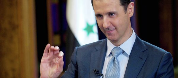 In this Tuesday, Feb. 10, 2015 file photo released by the Syrian official news agency SANA, Syrian President Bashar Assad gestures during an interview with the BBC, in Damascus, Syria - Sputnik International
