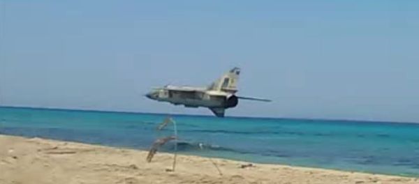 Libya FLAF Mig 23ML insane low pass over the beach Libya FLAF Mig 23ML insane low pass over the beach - Sputnik International