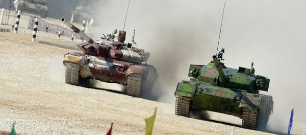 From right: Chinese and Russian crews ride Type 96A and T-72B tanks during a pursuit race of the Tank Biathlon 2014 World Championships at a training center of the Second Guards Taman Motorized Rifle Division in the town of Alabino From right: Chinese and Russian crews ride Type 96A and T-72B tanks during a pursuit race of the Tank Biathlon 2014 World Championships at a training center of the Second Guards Taman Motorized Rifle Division in the town of Alabino - Sputnik International