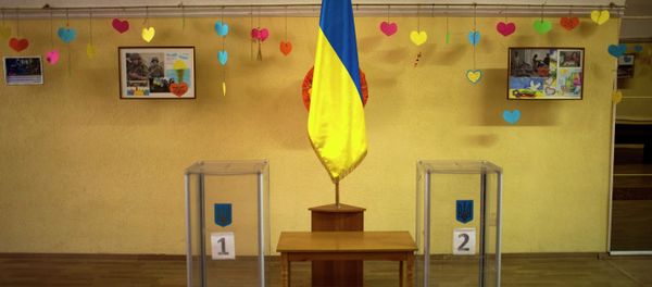 Ballot boxes await use inside a polling station in central Kiev, Ukraine, Friday, Oct. 24, 2014 - Sputnik International