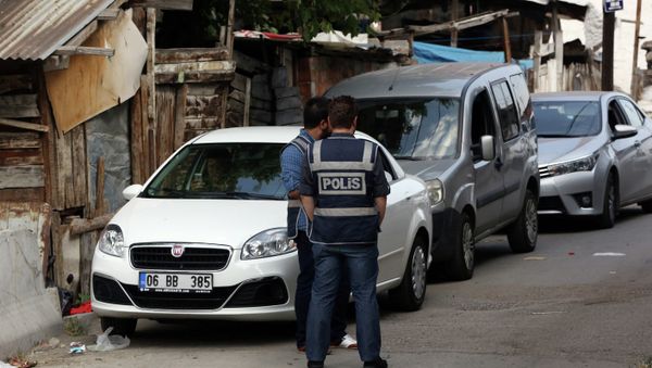 Police officers stand as Turkish police raide homes in Haci Bayram neighborhood in the capital Ankara, Turkey, Monday, July 27, 2015 - Sputnik International