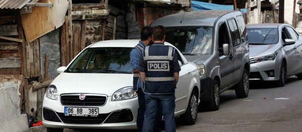 Police officers stand as Turkish police raide homes in Haci Bayram neighborhood in the capital Ankara, Turkey, Monday, July 27, 2015 Police officers stand as Turkish police raide homes in Haci Bayram neighborhood in the capital Ankara, Turkey, Monday, July 27, 2015 - Sputnik International