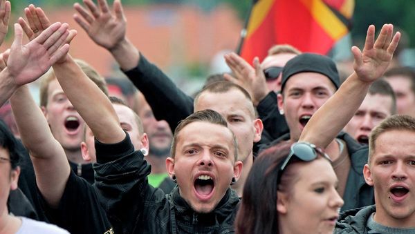 In this Friday, June 26, 2015 photo protesters demonstrate against the accommodation for immigrants in Freital near Dresden, eastern Germany. In this Friday, June 26, 2015 photo protesters demonstrate against the accommodation for immigrants in Freital near Dresden, eastern Germany. - Sputnik International