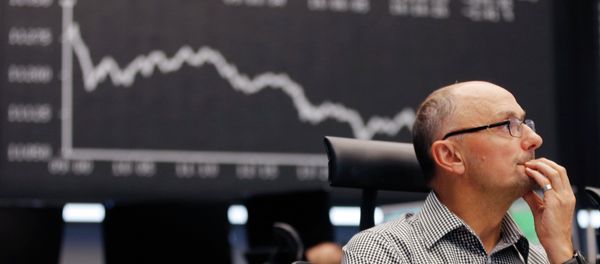 A trader watches his screens at the stock market in Frankfurt, Germany - Sputnik International