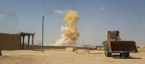 Smoke rises following a U.S.-led coalition airstrike against Islamic State group positions as a bulldozer belonging to the Iraqi security forces backed by Shiite and pro-government Sunni fighters is deployed for fighting against Islamic State group militants in Tash district in southern Ramadi, Anbar province, Iraq Smoke rises following a U.S.-led coalition airstrike against Islamic State group positions as a bulldozer belonging to the Iraqi security forces backed by Shiite and pro-government Sunni fighters is deployed for fighting against Islamic State group militants in Tash district in southern Ramadi, Anbar province, Iraq - Sputnik International