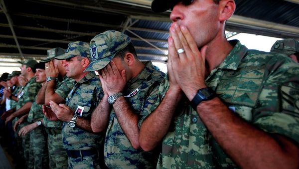 Turkish soldiers pray during the funeral of slain soldier Mehmet Yalcin Nane, killed Thursday by IS militants when they attacked a Turkish military outpost at the border with Syria, in the town of Gaziantep, southeastern Turkey, Friday, July 24, 2015. Turkish soldiers pray during the funeral of slain soldier Mehmet Yalcin Nane, killed Thursday by IS militants when they attacked a Turkish military outpost at the border with Syria, in the town of Gaziantep, southeastern Turkey, Friday, July 24, 2015. - Sputnik International