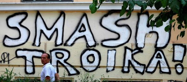 A pedestrian passes graffiti referring to the officials from the European Union, European Central Bank and International Monetary Fund, together known as the troika, in Athens, Wednesday, July 29, 2015. A pedestrian passes graffiti referring to the officials from the European Union, European Central Bank and International Monetary Fund, together known as the troika, in Athens, Wednesday, July 29, 2015. - Sputnik International