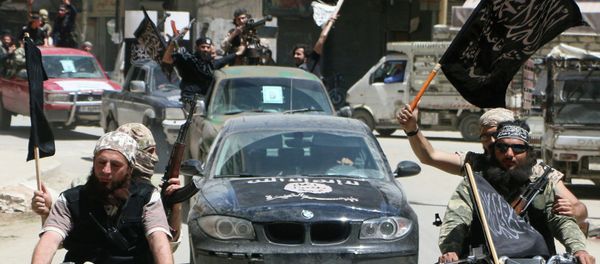 Fighters from Al-Qaeda's Syrian affiliate Al-Nusra Front drive in the northern Syrian city of Aleppo. (File) Fighters from Al-Qaeda's Syrian affiliate Al-Nusra Front drive in the northern Syrian city of Aleppo. (File) - Sputnik International
