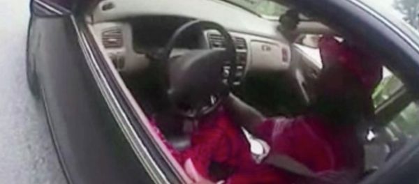 In this July 19, 2015 file photo from a body camera video provided by the University of Cincinnati Campus Police, university Officer Ray Tensing stands next to motorist Samuel DuBose during a traffic stop for a missing front license plate in Cincinnati. DuBose was fatally shot by the officer after a struggle ensued when he refused to provide a driver's license and get out of the car. Tensing was indicted Wednesday, July 29 on a murder charge. - Sputnik International