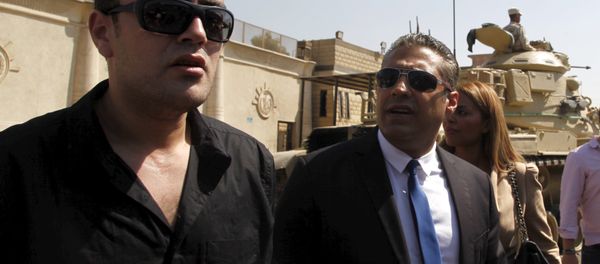 Al Jazeera television journalists Mohamed Fahmy (R) and Baher Mohamed talk to the media outside Tora prison, in Cairo, Egypt, July 30, 2015 Al Jazeera television journalists Mohamed Fahmy (R) and Baher Mohamed talk to the media outside Tora prison, in Cairo, Egypt, July 30, 2015 - Sputnik International