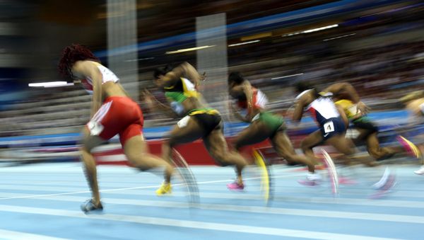Athletes compete in the Women 60 m Final event at the IAAF World Indoor Athletics Championships in the Ergo Arena in the Polish coastal town of Sopot, on March 9, 2014 - Sputnik International
