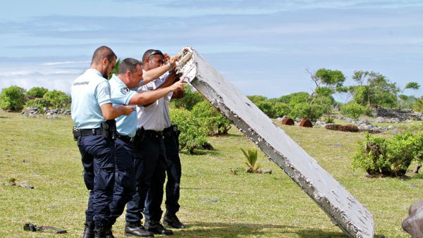 French police officers inspect a piece of debris from a plane in Saint-Andre, Reunion Island French police officers inspect a piece of debris from a plane in Saint-Andre, Reunion Island - Sputnik International