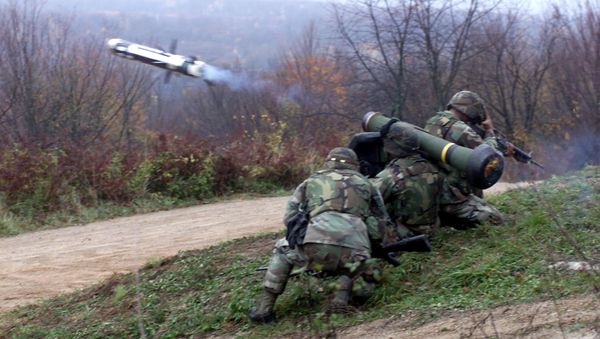 This 18 November 2000 DOD filer shows Corporal Allen Dantes, a Manila, Philippines native and Private First Class Ric Johnson, Newark N.J. native, both from Javelin Platoon, Weapons Company, Battalion Landing Team 2/2, 26th Marine Expeditionary Unit (Special Operations Capable), launching the first Javelin Missile ever to fired by deployed MEU during Exercise Slunj 2000 in Croatia - Sputnik International