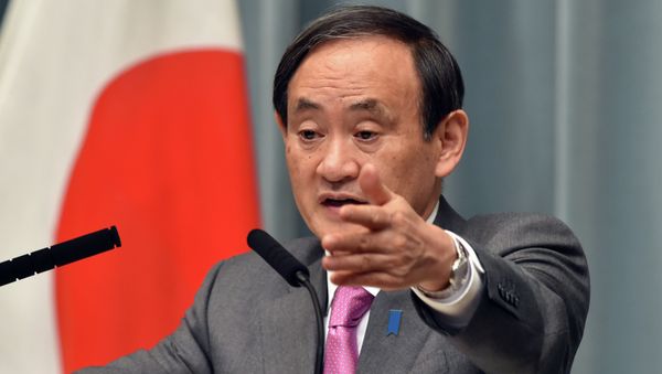 Japan's Chief Cabinet Secretary Yoshihide Suga points to a journalist at a press conference Japan's Chief Cabinet Secretary Yoshihide Suga points to a journalist at a press conference - Sputnik International
