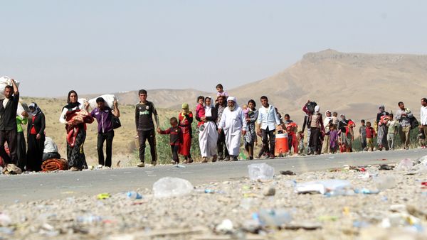 A file picture taken on August 13, 2014, shows displaced Iraqi families from the Yazidi community crossing the Iraqi-Syrian border at the Fishkhabur crossing, in northern Iraq A file picture taken on August 13, 2014, shows displaced Iraqi families from the Yazidi community crossing the Iraqi-Syrian border at the Fishkhabur crossing, in northern Iraq - Sputnik International