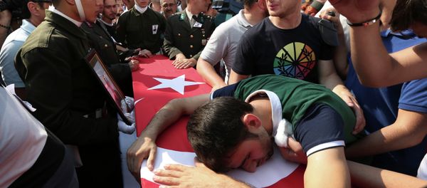 A relative cries over the Turkish flag-draped coffin of Turkish soldier Kagan Kandemir, during his funeral in the town of Civril, Turkey, July 31, 2015 - Sputnik International