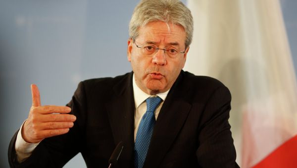 Italian Foreign Minister Paolo Gentiloni attends a news conference with his German counterpart Frank-Walter Steinmeier after a meeting at the foreign ministry in Berlin, Germany, Wednesday, June 17, 2015 Italian Foreign Minister Paolo Gentiloni attends a news conference with his German counterpart Frank-Walter Steinmeier after a meeting at the foreign ministry in Berlin, Germany, Wednesday, June 17, 2015 - Sputnik International