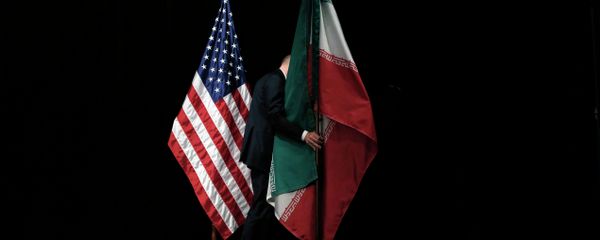 A staff member removes the Iranian flag from the stage after a group picture with foreign ministers and representatives of Unites States, Iran etc. A staff member removes the Iranian flag from the stage after a group picture with foreign ministers and representatives of Unites States, Iran etc. - Sputnik International