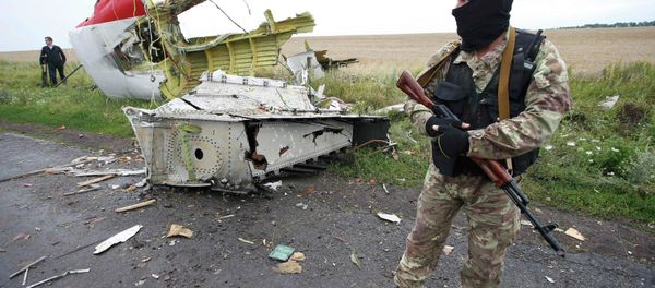 Independence supporter standing at the crash site of Malaysia Airlines flight MH17, near the settlement of Grabovo in the Donetsk region, is seen in this July 18, 2014 file photo Independence supporter standing at the crash site of Malaysia Airlines flight MH17, near the settlement of Grabovo in the Donetsk region, is seen in this July 18, 2014 file photo - Sputnik International