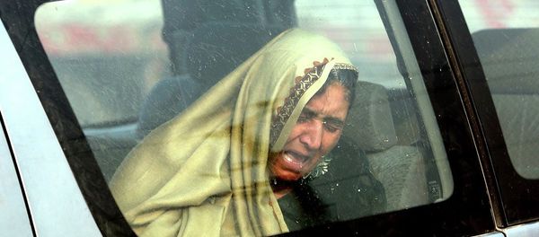 An Afghan woman cries at the site of a suicide attack in Kabul, Afghanistan Monday, Jan. 5, 2015. An Afghan woman cries at the site of a suicide attack in Kabul, Afghanistan Monday, Jan. 5, 2015. - Sputnik International
