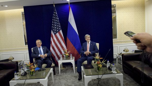 Russia's Foreign Minister Sergei Lavrov (L) and U.S. Secretary of State John Kerry sit next to each other before a bilateral meeting in Kuala Lumpur, Malaysia August 5, 2015 Russia's Foreign Minister Sergei Lavrov (L) and U.S. Secretary of State John Kerry sit next to each other before a bilateral meeting in Kuala Lumpur, Malaysia August 5, 2015 - Sputnik International