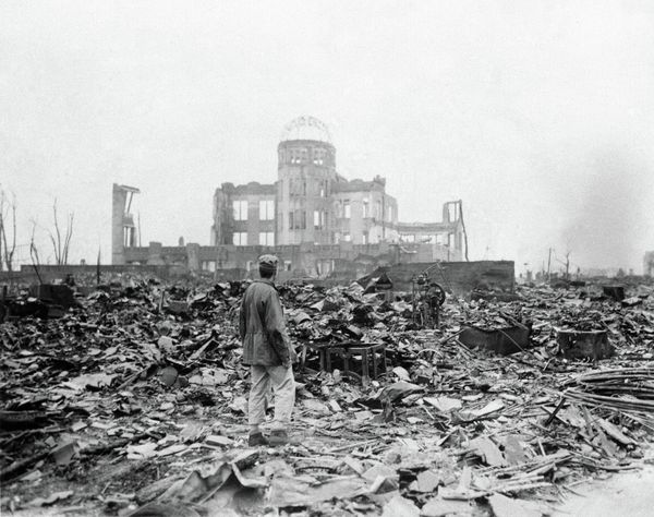 This Sept. 8, 1945 picture shows an allied correspondent standing in the rubble in front of the shell of a building This Sept. 8, 1945 picture shows an allied correspondent standing in the rubble in front of the shell of a building - Sputnik International