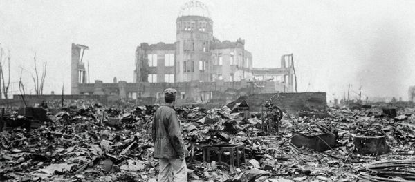 This Sept. 8, 1945 picture shows an allied correspondent standing in the rubble in front of the shell of a building This Sept. 8, 1945 picture shows an allied correspondent standing in the rubble in front of the shell of a building - Sputnik International