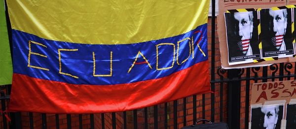 Placard with the slogan We are all Assange written in Spanish below another that reads Ecuador, country of freedom on the railings outside the Ecuadorian embassy in central London on June 21, 2012, where Assange is still holed up seeking political asylum. - Sputnik International