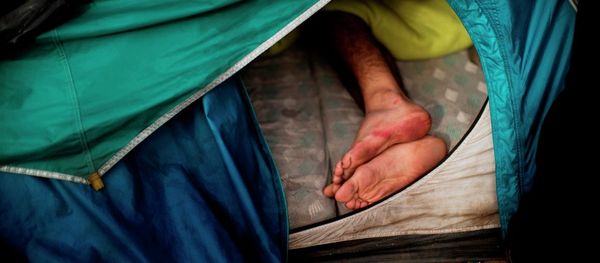 A migrant sleeps inside a tent at a camp set near Calais, northern France, Wednesday, Aug. 5, 2015. A migrant sleeps inside a tent at a camp set near Calais, northern France, Wednesday, Aug. 5, 2015. - Sputnik International