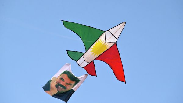 A kite in the colors of the Kurdish flag and with a photograph Abdullah Ocalan, the imprisoned leader of the Kurdistan Workers' Party (PKK) A kite in the colors of the Kurdish flag and with a photograph Abdullah Ocalan, the imprisoned leader of the Kurdistan Workers' Party (PKK) - Sputnik International