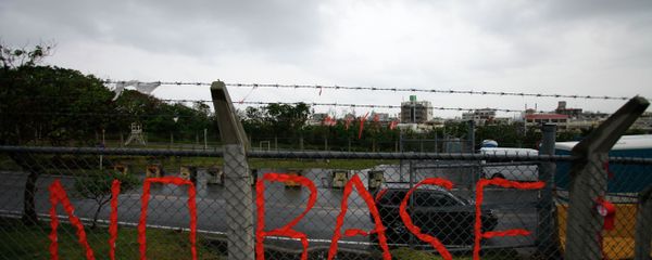 A slogan against the base is displayed on the fence enclosed U.S. Marine Corps Futenma Air Station in Ginowan on southern Japanese islands of Okinawa. File photo A slogan against the base is displayed on the fence enclosed U.S. Marine Corps Futenma Air Station in Ginowan on southern Japanese islands of Okinawa. File photo - Sputnik International