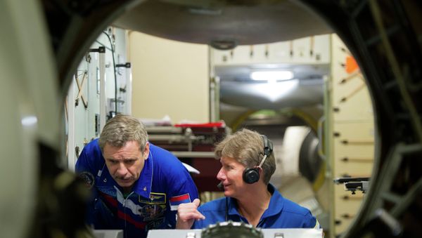 Russian Cosmonauts Mikhail Korniyenko (left) and Gennady Padalka, members of the International Space Station 43/44 crew, seen during their work-outs on the ISS simulator at the Star City - Sputnik International