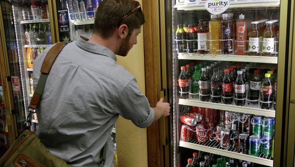 Ezra, last name not given, looks at the soft drink selection at K & D Market in San Francisco, Wednesday, Oct. 1, 2014 - Sputnik International