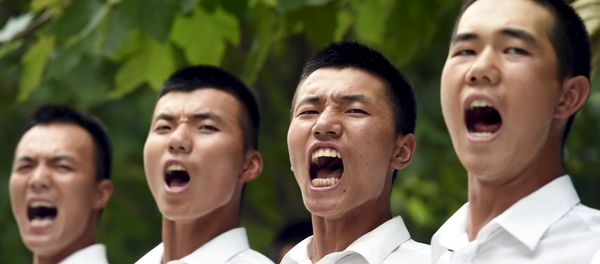 Paramilitary policemen and members of a gun salute team shout slogans as they stand in formation during a training session for a military parade to mark the 70th anniversary of the end of the World War Two, at a military base in Beijing, China, August 1, 2015 Paramilitary policemen and members of a gun salute team shout slogans as they stand in formation during a training session for a military parade to mark the 70th anniversary of the end of the World War Two, at a military base in Beijing, China, August 1, 2015 - Sputnik International