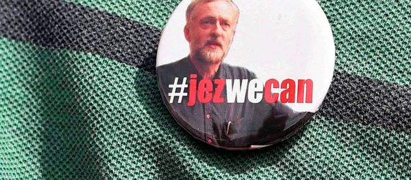 A supporter wears a campaign badge as British Labour Party politician Jeremy Corbyn arrives for a community meeting in north London August 9, 2015. A supporter wears a campaign badge as British Labour Party politician Jeremy Corbyn arrives for a community meeting in north London August 9, 2015. - Sputnik International