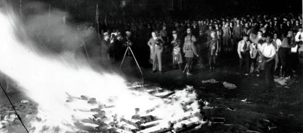 Flames roar high as a crowd gathers to witness thousands of books, considered to be un-German, burn in Opera Square in Berlin, Germany, during the Buecherverbrennung, book burnings on May 10, 1933. - Sputnik International