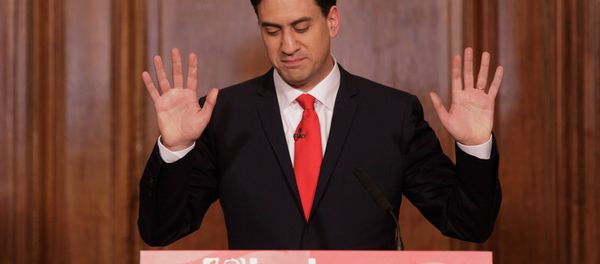 Britain's Labour Party leader Ed Miliband holds up his hands as he delivers his resignation at a press conference in Westminster, London, Friday, May 8, 2015 - Sputnik International