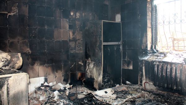 A building destroyed by shelling of the Oktyabrsky village in the Kuibyshevsky district of Donetsk - Sputnik International