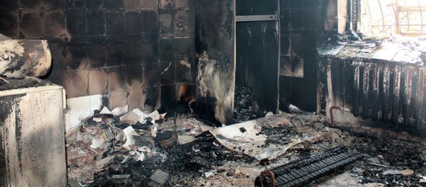 A building destroyed by shelling of the Oktyabrsky village in the Kuibyshevsky district of Donetsk - Sputnik International